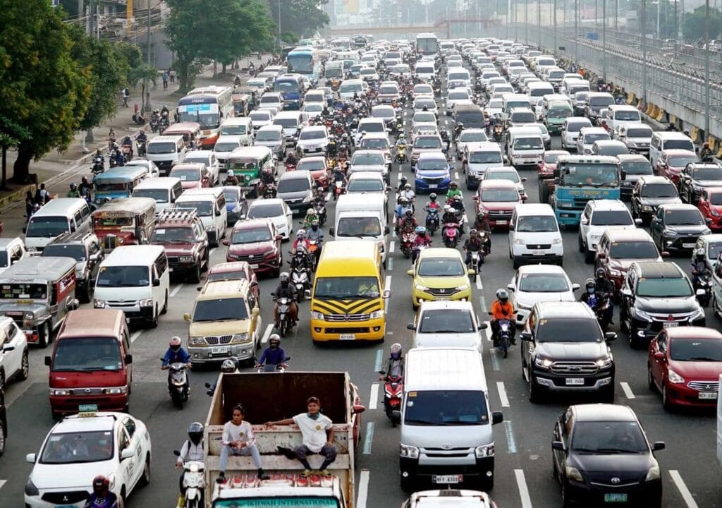 The Ultimate Travel Guide To The Philippines: What's not to be excited about? 4 Heavy rush hour traffic in Metro Manila with cars, motorcycles, and public utility vehicles crowding a major road in the Philippines.